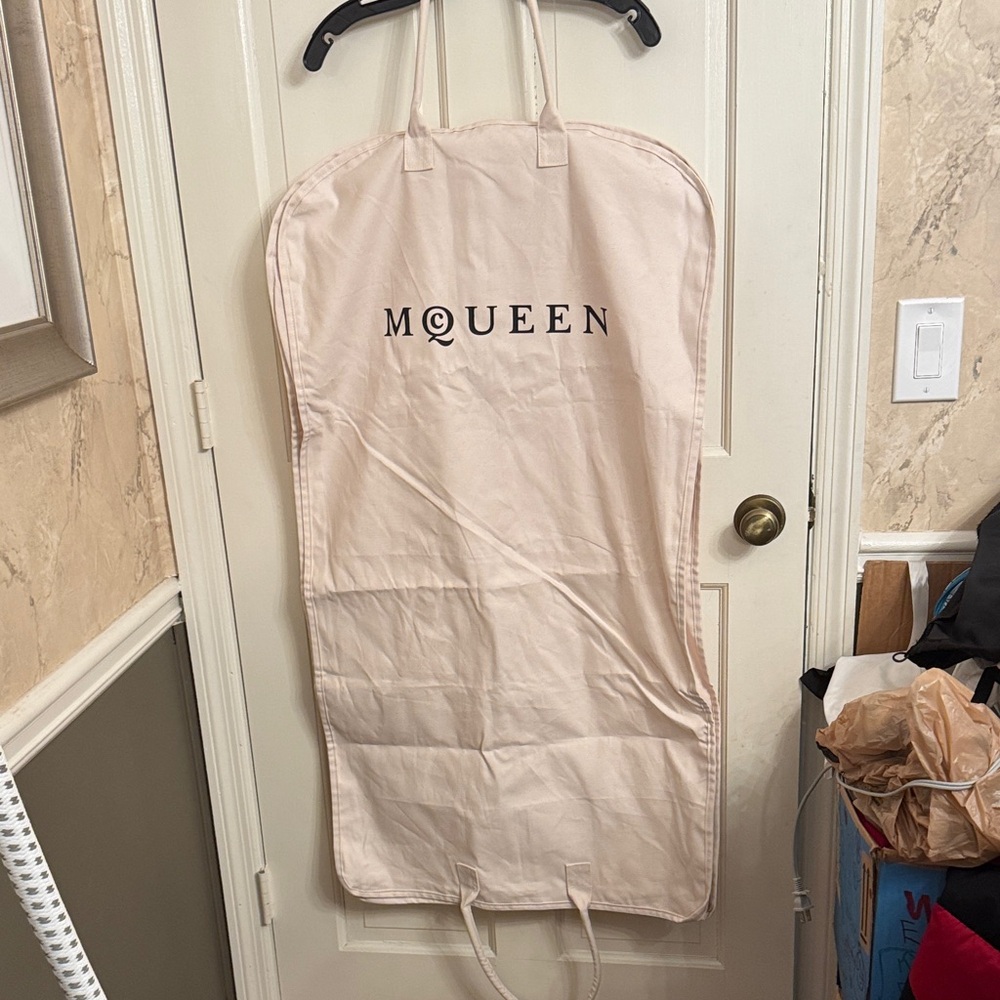 New McQueen Cream Garment Bag with hanger